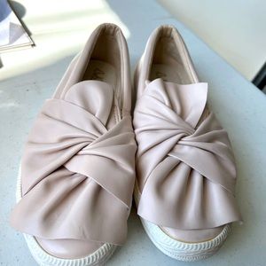 Slip on tennis shoe in a size 8 light pink